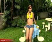 Feminine shemale in yellow bikini showcases her round boobs from teen shemale sue
