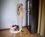 A naked lady does make-up in front of a mirror, puts on underwear, stockings, a skirt. c3 from skirting naked